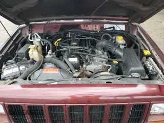 2000 Jeep Cherokee with VIN 1J4FF48SXYL198290, listed as a Copart auction lot 66026705 with 201,409 mi miles and Clean title. Bid and sale history available at DreamBid. Image 11.