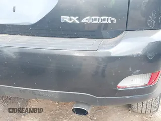 2007 Lexus RX 400h z VIN JTJGW31U372002594, wystawiony jako IAAI lot #41380924 z przebiegiem 243 928 mil mil oraz . Historia ofert i sprzedaży dostępna na DreamBid. Obrazek 14.