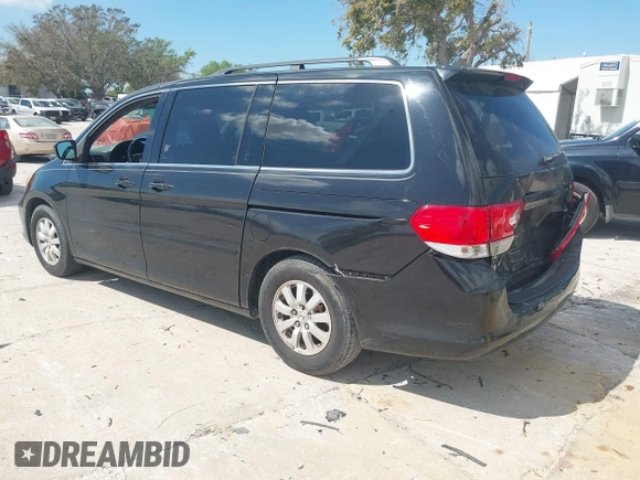 2010 Honda Odyssey EX-L with VIN 5FNRL3H79AB028724, listed as a IAAI auction lot 41687998 with 221,852 mi miles. Bid and sale history available at carsss.com. Image 3.