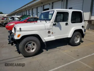 2000 Jeep Wrangler Sahara z VIN 1J4FA59S0YP742758, wystawiony jako Copart lot #63563845 z przebiegiem 196 896 mil mil oraz Czysty tytuł • Clean title. Historia ofert i sprzedaży dostępna na DreamBid. Obrazek 1.