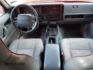 1996 Jeep Cherokee Sport with VIN 1J4FJ68S8TL285995, listed as a Copart auction lot 73333574 with 187,429 mi miles and Salvage Title. Bid and sale history available at carsss.com. Image 8.