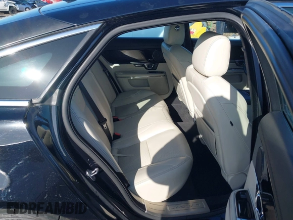 2015 Jaguar XJ with VIN SAJWA1CZ2F8V84677, listed as a IAAI auction lot 41723372 with 52,888 mi miles. Bid and sale history available at carsss.com. Image 8.