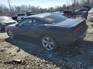 2014 Dodge Challenger R/T Plus z VIN 2C3CDYBT5EH108936, wystawiony jako Copart lot #46652305 z przebiegiem 229 673 mil mil oraz Szkoda całkowita • Salvage title. Historia ofert i sprzedaży dostępna na DreamBid. Obrazek 2.