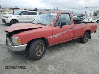 1992 Toyota Pickup DLX z VIN JT4RN82PXN5046950, wystawiony jako Copart lot #76885084 z przebiegiem 121 066 mil mil oraz Szkody całkowita. Historia ofert i sprzedaży dostępna na DreamBid. Obrazek 1.