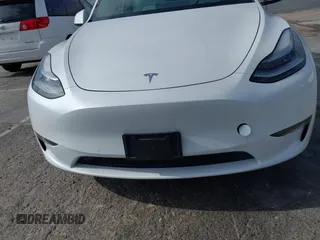 2021 Tesla Model Y Long Range with VIN 5YJYGDEE0MF069451, listed as a IAAI auction lot 41482649 with 55,542 mi miles. Bid and sale history available at carsss.com. Image 6.