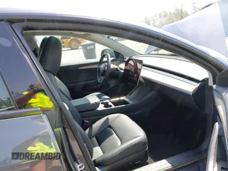 2023 Tesla Model 3 with VIN 5YJ3E1EA6PF664045, listed as a IAAI auction lot 42561039 with 18,708 mi miles and . Bid and sale history available at DreamBid. Image 5.