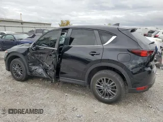 2020 Mazda CX-5 Touring with VIN JM3KFBCM1L0792706, listed as a Copart auction lot 73032144 with 56,845 mi miles and Salvage Title. Bid and sale history available at carsss.com. Image 2.