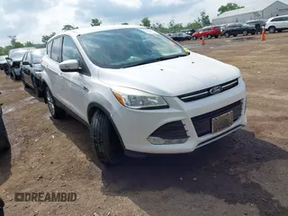 2013 Ford Escape SEL z VIN 1FMCU9HX6DUB14053, wystawiony jako IAAI lot #42361297 z przebiegiem 144 861 mil mil oraz . Historia ofert i sprzedaży dostępna na DreamBid. Obrazek 1.