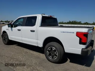 2023 Ford F-150 Lightning Pro with VIN 1FT6W1EVXPWG44972, listed as a Copart auction lot 60303485 with 19,788 mi miles and Salvage title. Bid and sale history available at DreamBid. Image 2.