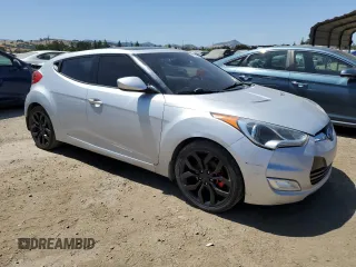 2013 Hyundai Veloster w/Gray Int z VIN KMHTC6AD9DU138719, wystawiony jako Copart lot #57494735 z przebiegiem 149 255 mil mil oraz Szkoda całkowita • Salvage title. Historia ofert i sprzedaży dostępna na DreamBid. Obrazek 4.