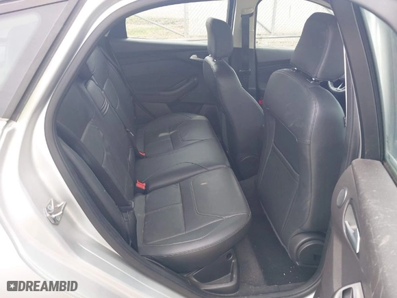 2015 Ford Focus Titanium with VIN 1FADP3N27FL228549, listed as a IAAI auction lot 41912941 with 69,025 mi miles. Bid and sale history available at carsss.com. Image 8.