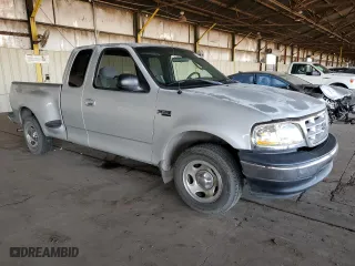 2003 Ford F-150 XL with VIN 1FTRX07233KD43811, listed as a Copart auction lot 85113414 with 215,390 mi miles and Salvage Title. Bid and sale history available at carsss.com. Image 4.