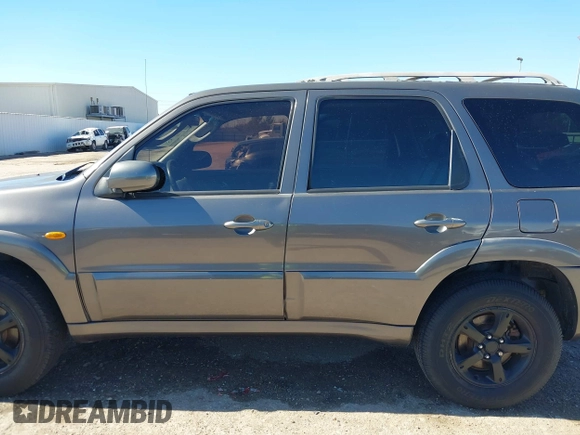 2005 Mazda Tribute S with VIN 4F2CZ06175KM49643, listed as a IAAI auction lot 41397843 with 185,088 mi miles and . Bid and sale history available at carsss.com. Image 14.