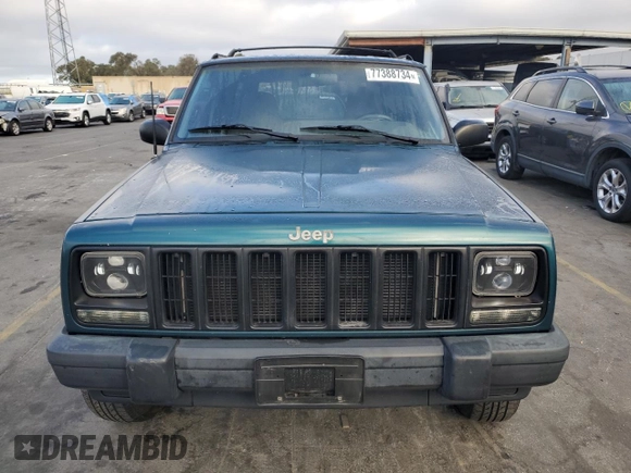 1998 Jeep Cherokee Sport with VIN 1J4FT68S2WL236774, listed as a Copart auction lot 77388734 with 128,591 mi miles and Clean Title. Bid and sale history available at carsss.com. Image 5.