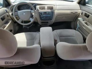 2007 Ford Taurus SE with VIN 1FAFP53U27A156844, listed as a Copart auction lot 59204695 with 157,633 mi miles and Salvage title. Bid and sale history available at DreamBid. Image 8.