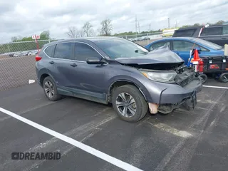 2017 Honda CR-V LX z VIN 7FARW5H35HE009215, wystawiony jako IAAI lot #41922515 z przebiegiem 186 660 mil mil oraz . Historia ofert i sprzedaży dostępna na DreamBid. Obrazek 1.