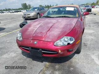 1997 Jaguar XK with VIN SAJGX2743VC017588, listed as a IAAI auction lot 42055716 with 66,052 mi miles and . Bid and sale history available at DreamBid. Image 6.