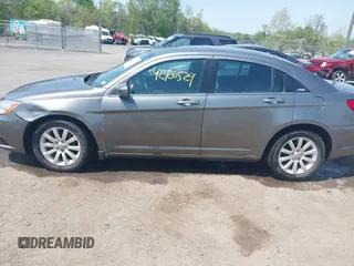 2012 Chrysler 200 Touring with VIN 1C3CCBBGXCN326023, listed as a IAAI auction lot 42126529 with 163,325 mi miles and . Bid and sale history available at carsss.com. Image 14.