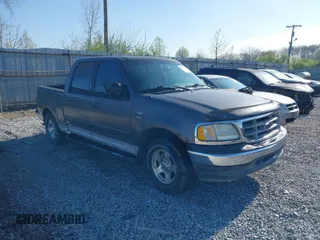 2003 Ford F-150 XLT with VIN 1FTRW07L13KB66977, listed as a IAAI auction lot 41967541 with 124,714 mi miles. Bid and sale history available at carsss.com. Image 1.