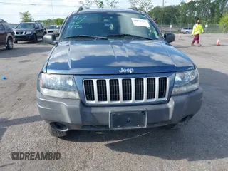2004 Jeep Grand Cherokee Laredo with VIN 1J4GW48S24C101792, listed as a IAAI auction lot 41995351 with 138,317 mi miles. Bid and sale history available at carsss.com. Image 6.