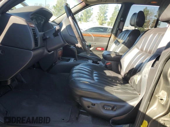 1999 Jeep Grand Cherokee Limited with VIN 1J4G268SXXC759016, listed as a Copart auction lot 80307534 with 215,870 mi miles and Salvage title. Bid and sale history available at DreamBid. Image 7.