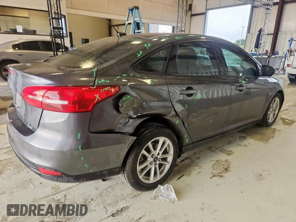 2018 Ford Focus SE with VIN 1FADP3FE0JL311760, listed as a Copart auction lot 63621755 with 81,000 mi miles and Salvage title. Bid and sale history available at DreamBid. Image 3.