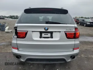 2012 BMW X5 35i with VIN 5UXZV4C57CL747717, listed as a Copart auction lot 63003135 with 135,999 mi miles and Clean title. Bid and sale history available at DreamBid. Image 6.