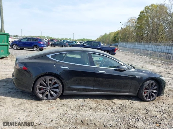 2015 Tesla Model S 85 kWh Battery with VIN 5YJSA1S11FFP79033, listed as a IAAI auction lot 41924740 with NaN miles. Bid and sale history available at carsss.com. Image 14.