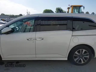 2014 Honda Odyssey Touring with VIN 5FNRL5H94EB001479, listed as a IAAI auction lot 41123678 with 147,269 mi miles and . Bid and sale history available at carsss.com. Image 14.