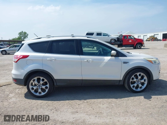 2015 Ford Escape Titanium with VIN 1FMCU0JX4FUB07322, listed as a IAAI auction lot 42220345 with 184,852 mi miles and . Bid and sale history available at DreamBid. Image 13.