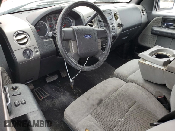 2004 Ford F-150 XL with VIN 1FTRF14524NC39799, listed as a Copart auction lot 59115774 with 156,709 mi miles and Salvage Title. Bid and sale history available at DreamBid. Image 8.