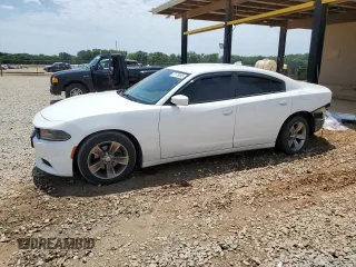 2015 Dodge Charger SXT with VIN 2C3CDXHG6FH798900, listed as a Copart auction lot 57179095 with 151,676 mi miles and Salvage title. Bid and sale history available at DreamBid. Image 1.