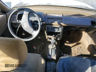 1989 Honda Civic z VIN JHMED6451KS002428, wystawiony jako Copart lot #86497404 z przebiegiem 241 207 mil mil oraz Szkoda całkowita • Salvage title. Historia ofert i sprzedaży dostępna na DreamBid. Obrazek 8.