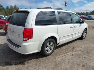 2012 Dodge Grand Caravan SXT with VIN 2C4RDGCGXCR248859, listed as a IAAI auction lot 41829411 with 111,515 mi miles and . Bid and sale history available at DreamBid. Image 4.
