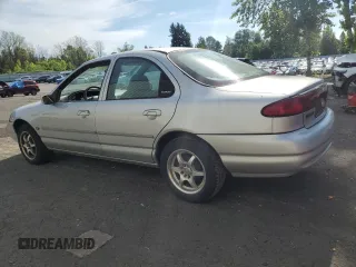 1998 Ford Contour LX with VIN 1FAFP66L2WK290948, listed as a Copart auction lot 56204295 with 76,307 mi miles and Salvage title. Bid and sale history available at DreamBid. Image 2.