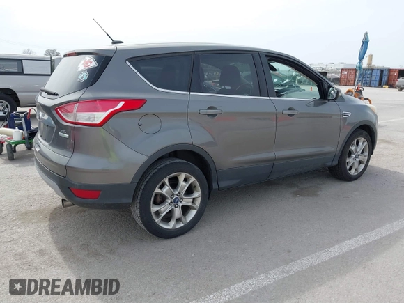 2013 Ford Escape SEL with VIN 1FMCU0HX5DUB82534, listed as a IAAI auction lot 41769014 with 182,433 mi miles. Bid and sale history available at carsss.com. Image 4.