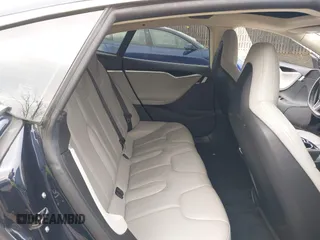 2014 Tesla Model S 60 with VIN 5YJSA1S12EFP42605, listed as a IAAI auction lot 40905031 with 68,155 mi miles and . Bid and sale history available at DreamBid. Image 8.