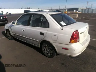2004 Hyundai Accent GL with VIN KMHCG45C04U498939, listed as a IAAI auction lot 41384821 with 247,994 mi miles. Bid and sale history available at carsss.com. Image 3.