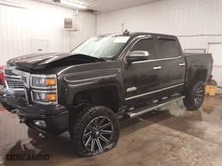 2015 Chevrolet Silverado 1500 High Country with VIN 3GCUKTEJXFG320011, listed as a IAAI auction lot 41366273 with 157,947 mi miles. Bid and sale history available at carsss.com. Image 2.