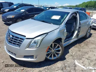2014 Cadillac XTS Luxury z VIN 2G61M5S31E9199170, wystawiony jako IAAI lot #42150000 z przebiegiem 135 414 mil mil oraz . Historia ofert i sprzedaży dostępna na DreamBid. Obrazek 17.