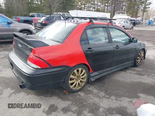 2003 Mitsubishi Lancer OZ-Rally with VIN JA3AJ86E03U078826, listed as a IAAI auction lot 41700333 with 119,656 mi miles. Bid and sale history available at carsss.com. Image 4.
