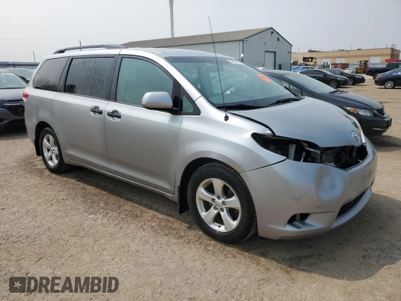 2014 Toyota Sienna L with VIN 5TDZK3DC8ES442973, listed as a Copart auction lot 59660055 with 310,496 mi miles and Salvage title. Bid and sale history available at DreamBid. Image 4.