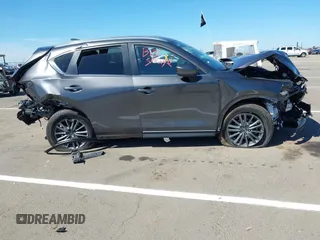 2019 Mazda CX-5 Touring with VIN JM3KFACM1K0533142, listed as a IAAI auction lot 41880181 with Not Provided miles and . Bid and sale history available at carsss.com. Image 13.