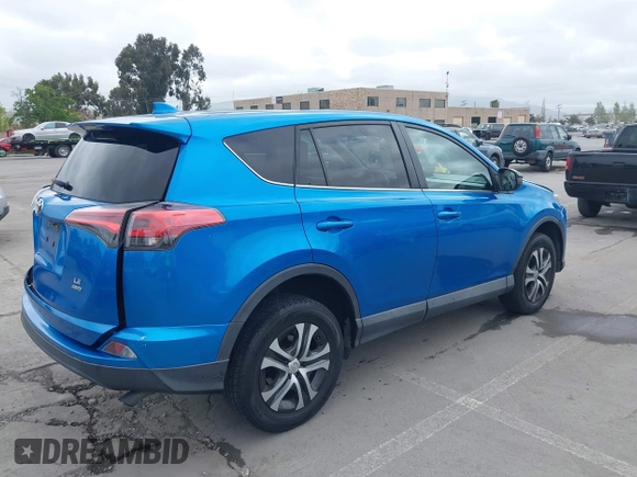 2018 Toyota RAV4 LE with VIN 2T3BFREV6JW740214, listed as a IAAI auction lot 42106349 with 105,831 mi miles and . Bid and sale history available at carsss.com. Image 4.
