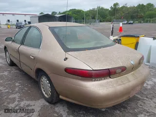 1996 Mercury Sable LS with VIN 1MELM53S6TA606332, listed as a IAAI auction lot 41984196 with 150,924 mi miles. Bid and sale history available at carsss.com. Image 3.