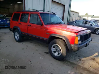 1996 Jeep Cherokee Sport with VIN 1J4FJ68S8TL285995, listed as a Copart auction lot 73333574 with 187,429 mi miles and Salvage Title. Bid and sale history available at carsss.com. Image 4.