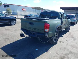 2016 Toyota Tacoma SR with VIN 3TMCZ5ANXGM038420, listed as a IAAI auction lot 41635372 with 113,723 mi miles. Bid and sale history available at carsss.com. Image 4.