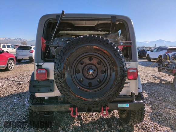 2004 Jeep Wrangler Rubicon with VIN 1J4FA69S14P749749, listed as a Copart auction lot 44458485 with 99,121 mi miles and Salvage Title. Bid and sale history available at carsss.com. Image 6.