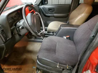 1999 Jeep Cherokee Sport with VIN 1J4FF68S4XL661115, listed as a Copart auction lot 47522675 with 200,630 mi miles and Salvage Title. Bid and sale history available at carsss.com. Image 7.