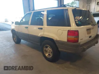 1997 Jeep Grand Cherokee Laredo with VIN 1J4GZ58SXVC552435, listed as a IAAI auction lot 41977888 with 143,832 mi miles. Bid and sale history available at carsss.com. Image 3.